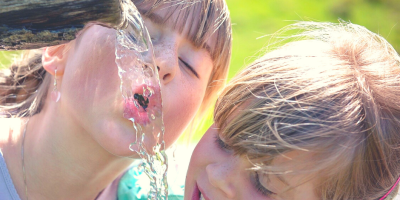 thirsty - girls drinking from a water pipe - when you long for soul refreshment during Lent @joylenton.com