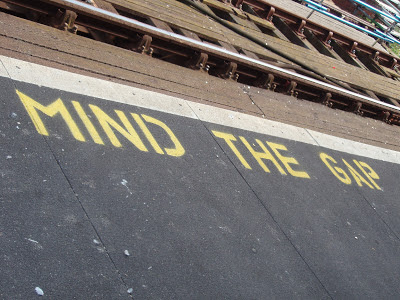 mind the gap road sign