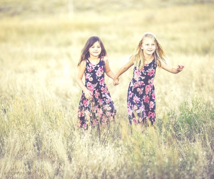 two girls playing in a field - girls just wanna have fun - @wordsofjoy.me