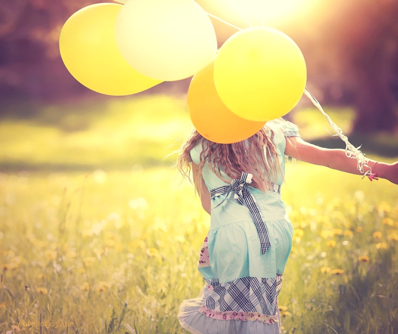 joy - discerning fake, festive and faith experiences - image of girl with balloons @wordsofjoy.me