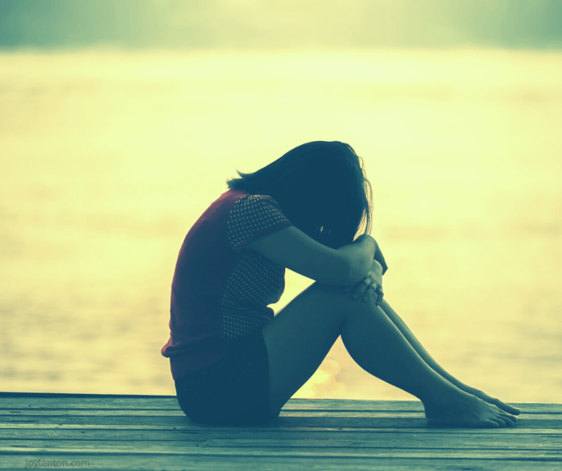 anxiety - woman with bowed head - having peace when we feel anxious or fearful @joylenton.com