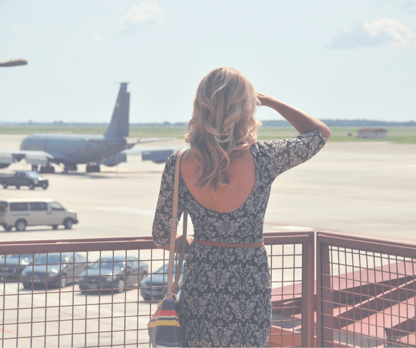 holding - uncertainty - woman scanning sky for planes - @joylenton.com